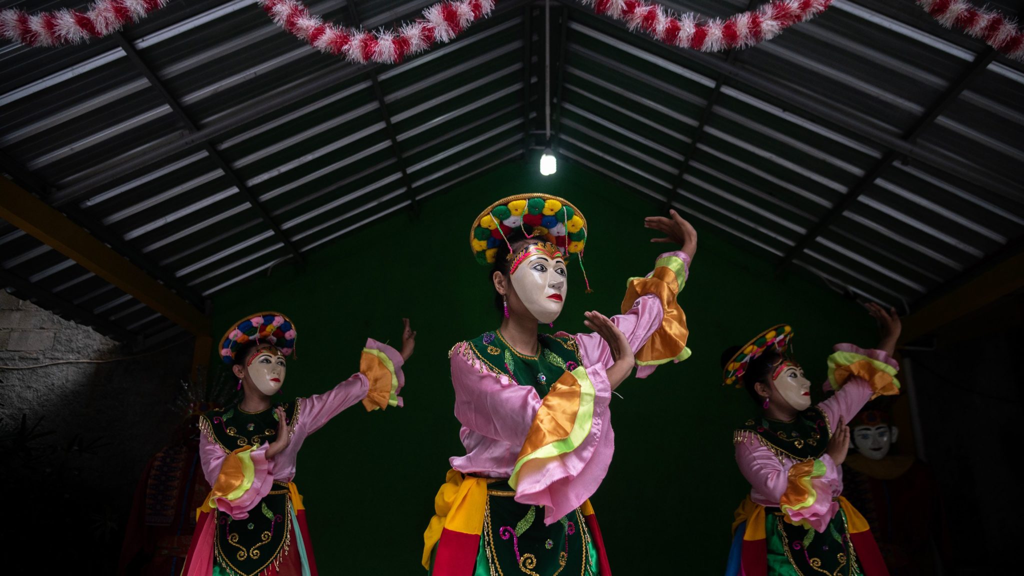 Dancers perform the Betawi Mask Dance at Setu Babakan Dance Workshop and Studio in Jakarta, Indonesia.