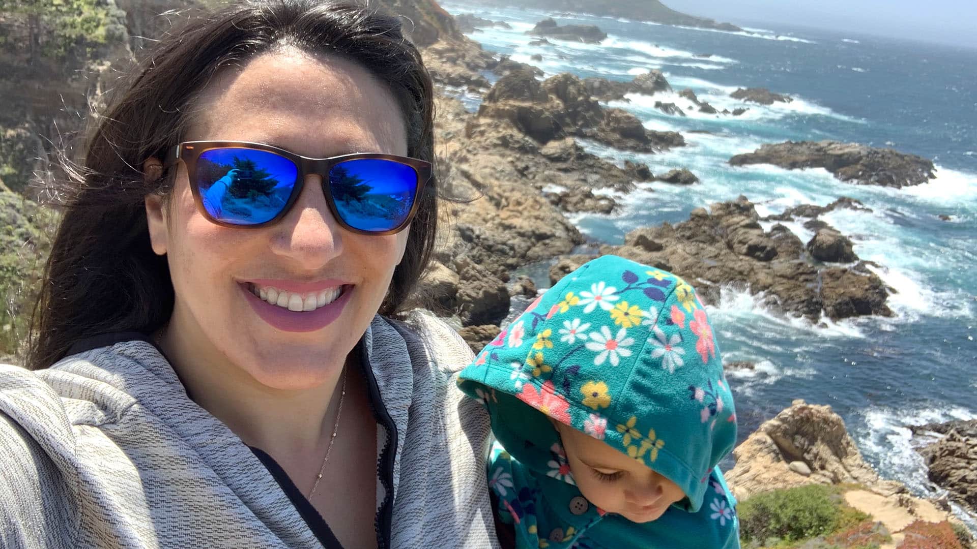 mother and child overlooking California coastline