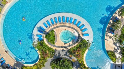 the pool and sunbathers at Courtyard Bali Nusa Dua Resort