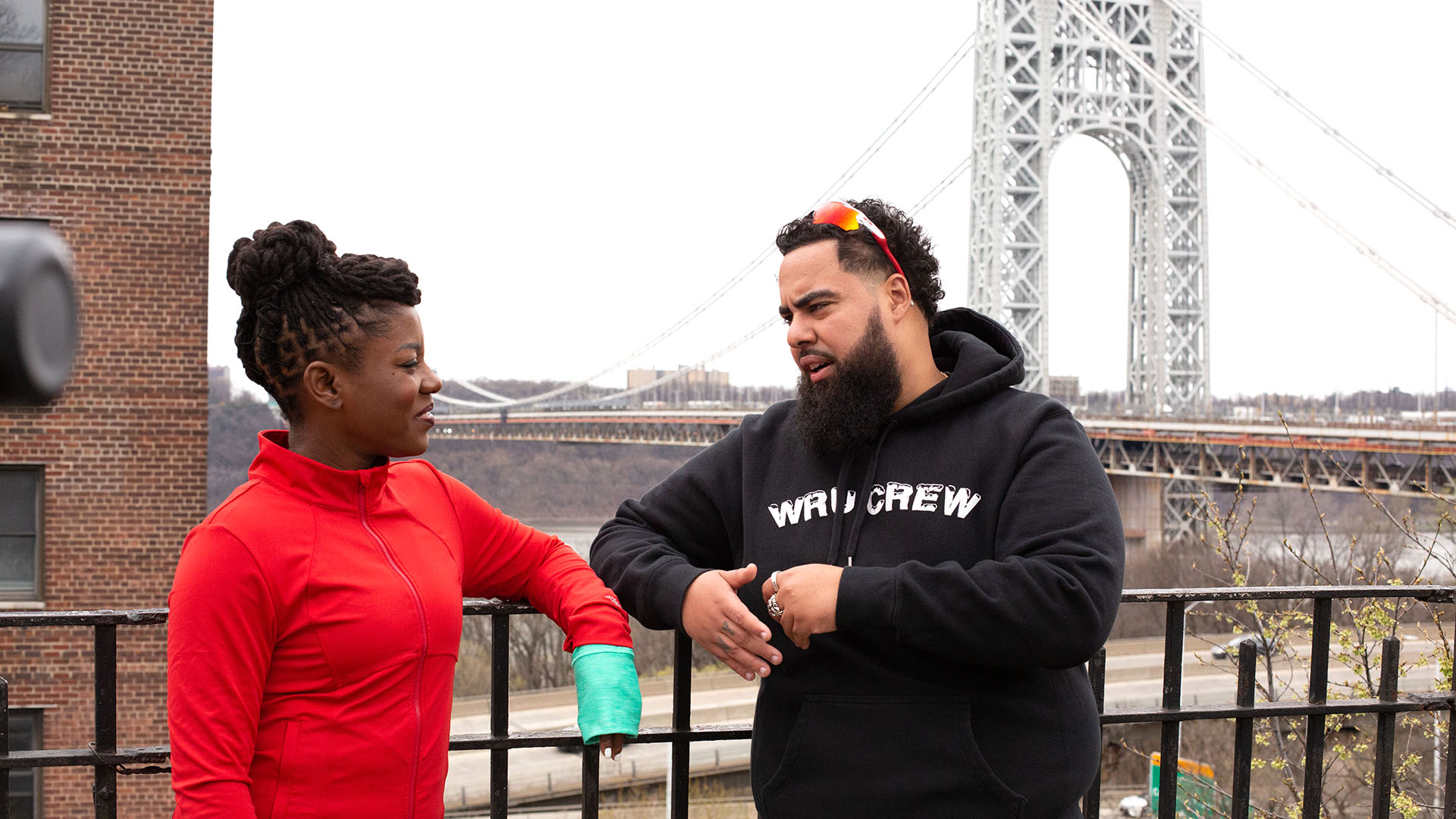 About the Journey podcast host Oneika Raymond and We Run Uptown founder Hector Espinal talk by the George Washington Bridge