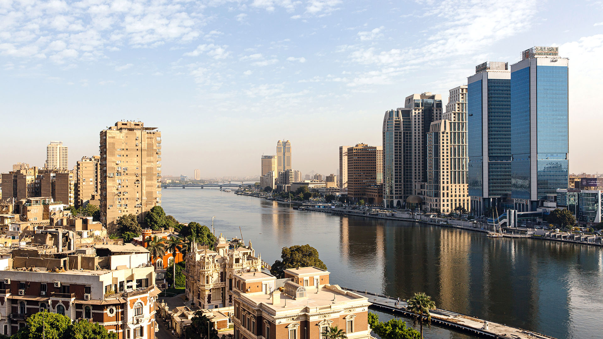 Old city and greenspace and new modern high rises by waterfront in Cairo, Egypt