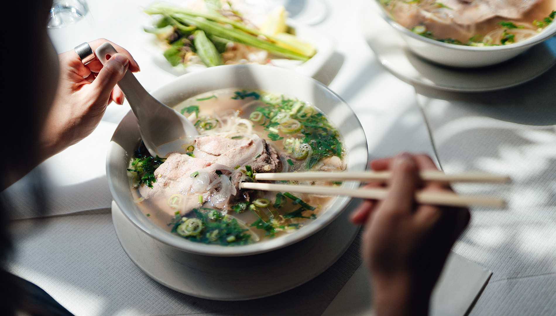 Chicken pho with chopsticks and a spoon, Eat Around Town Marriott Bonvoy