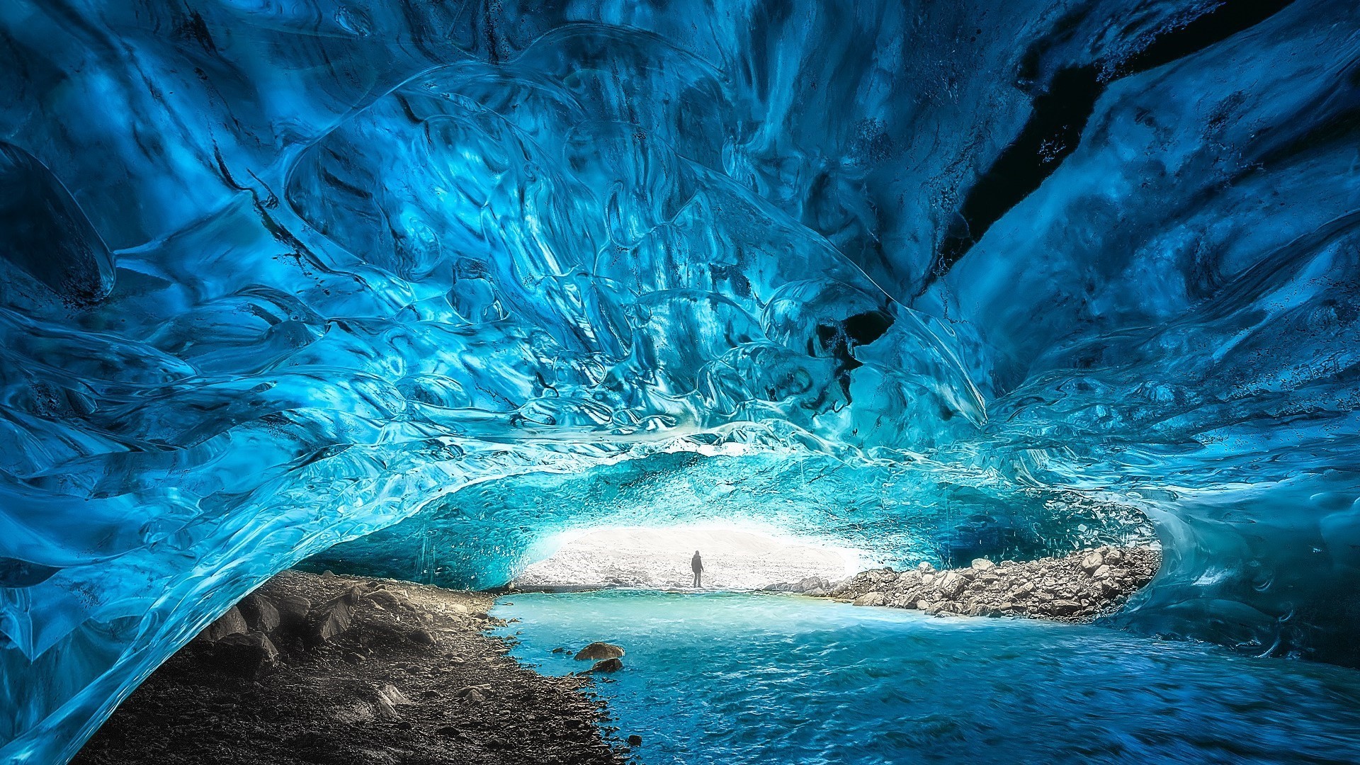 person in blue ice cave in Vatnajökull National Park