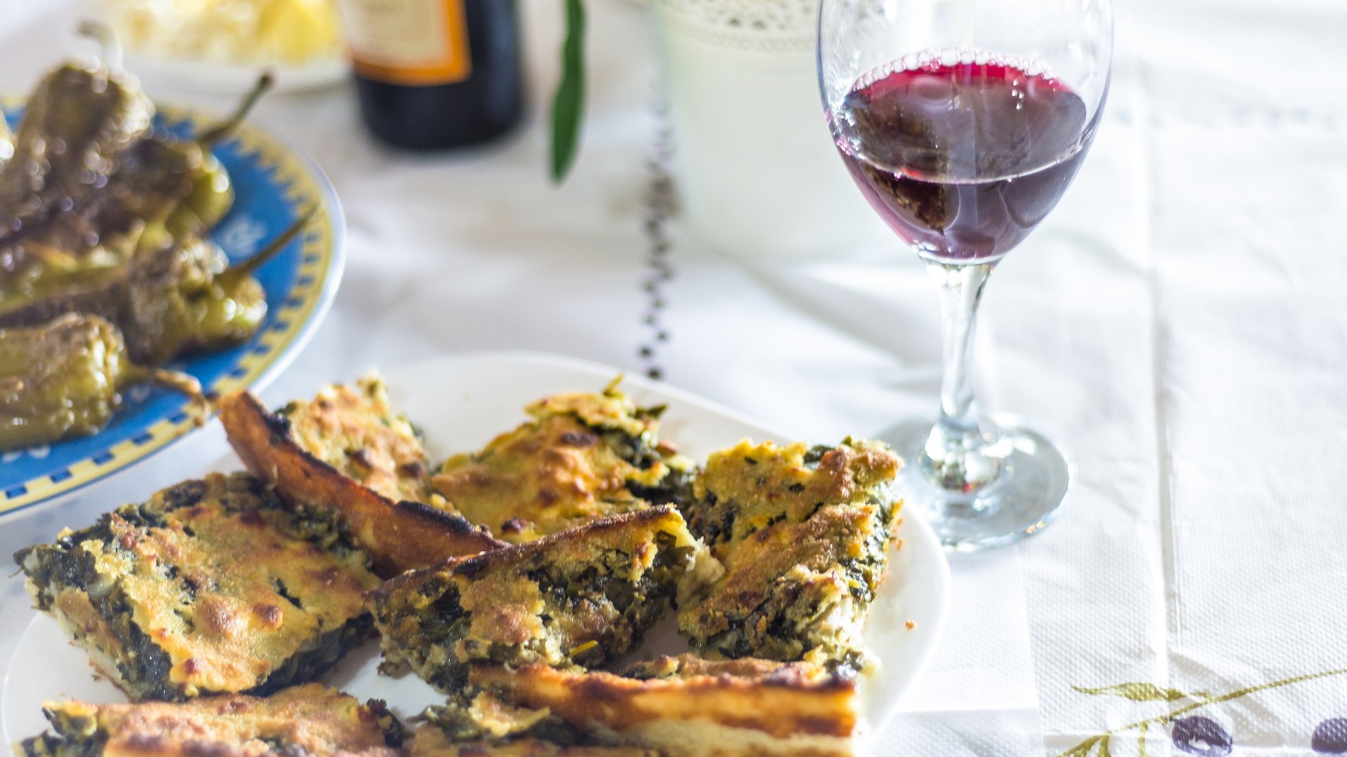 Albanian spinach byrek pastry, red wine and roast peppers
