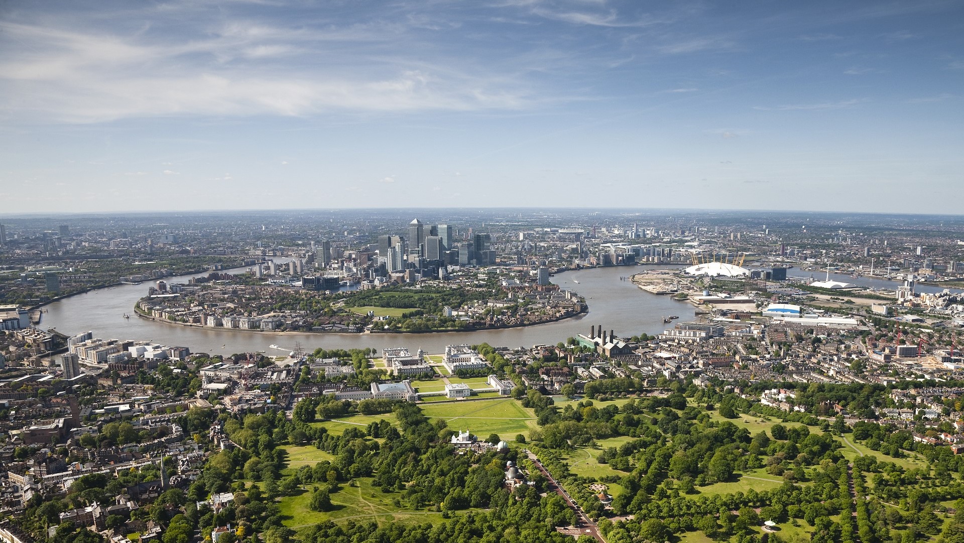aerial view of the Thames, parks, and skyscrapers in London