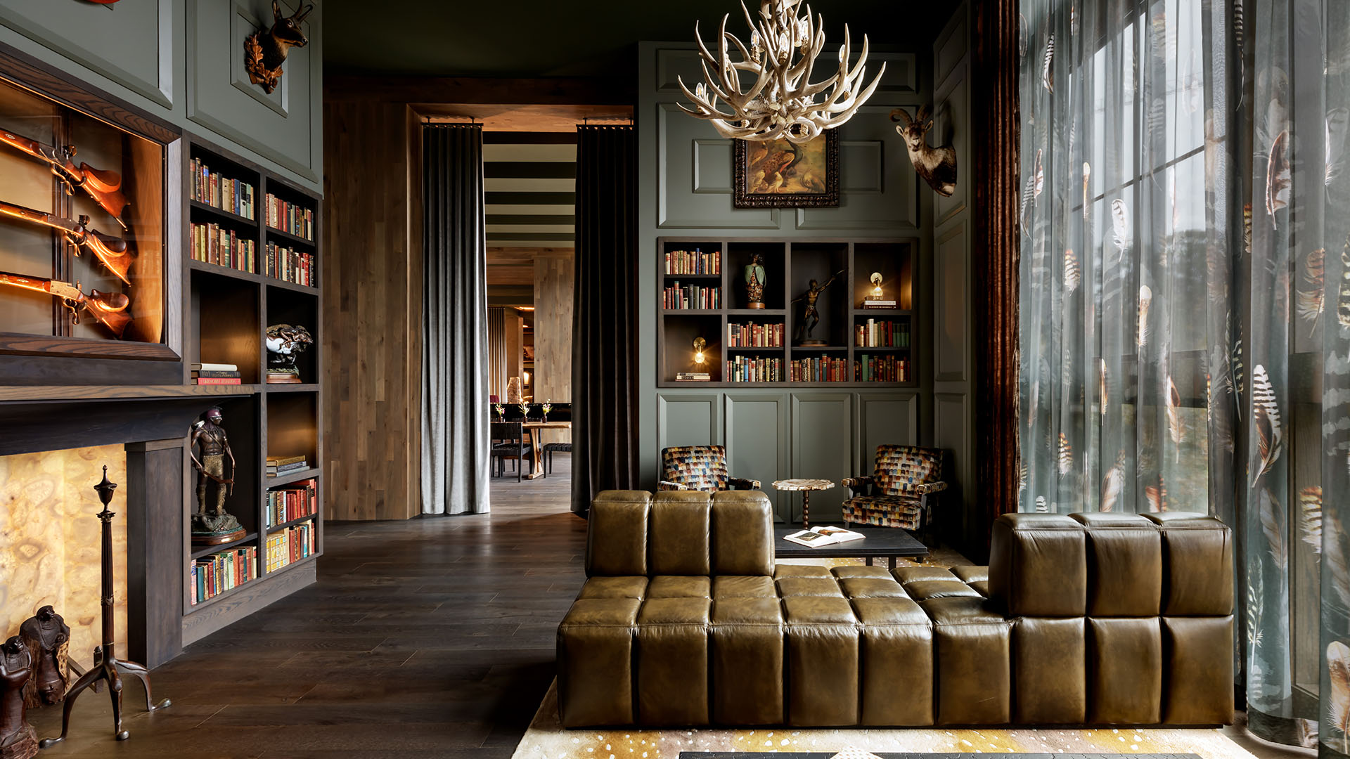 Dark library with vintage furniture in Grand Bohemian Lodge Greenville, Autograph Collection