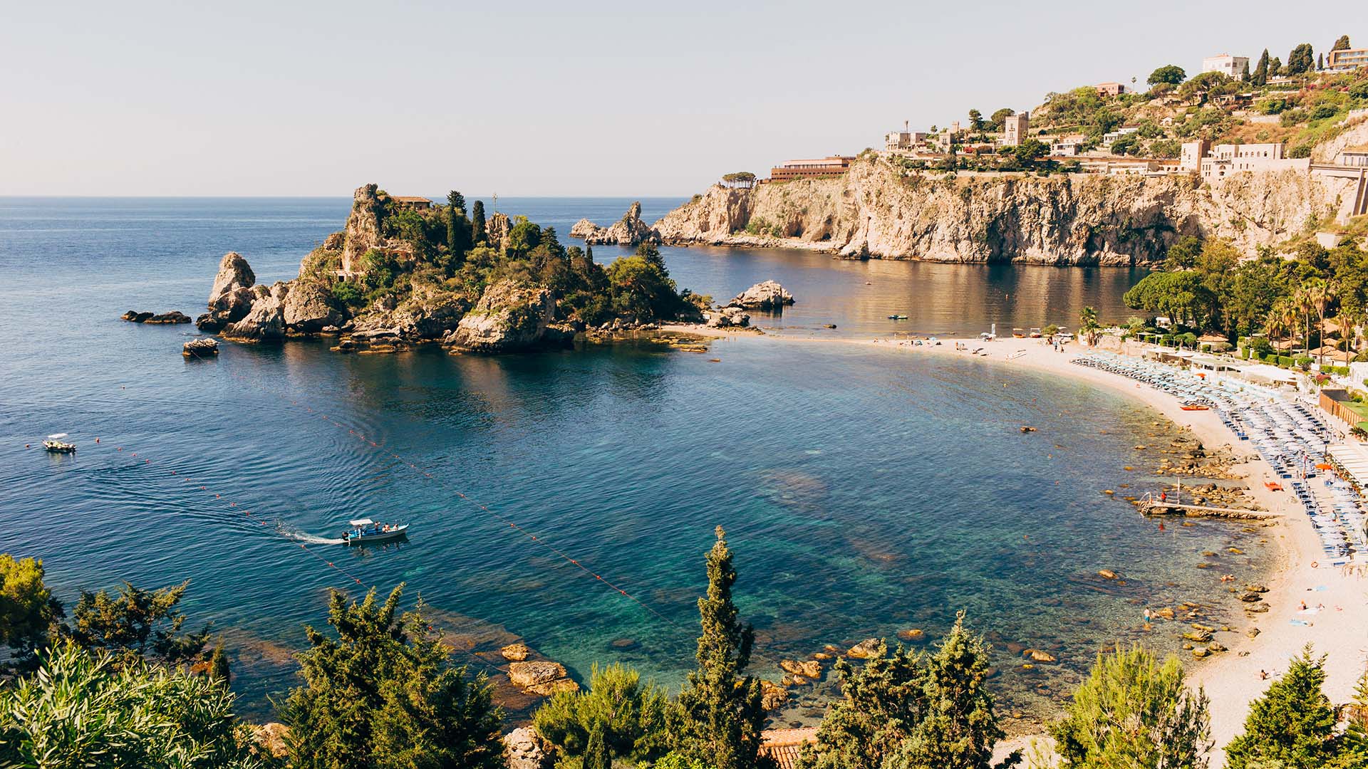 Blue water and cliffs in Taormina and Isola Bella in Sicily, Italy,