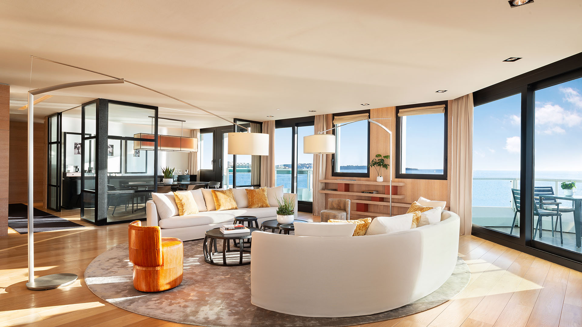 JW Marriott Cannes Presidential suite living room and dining room with ocean views