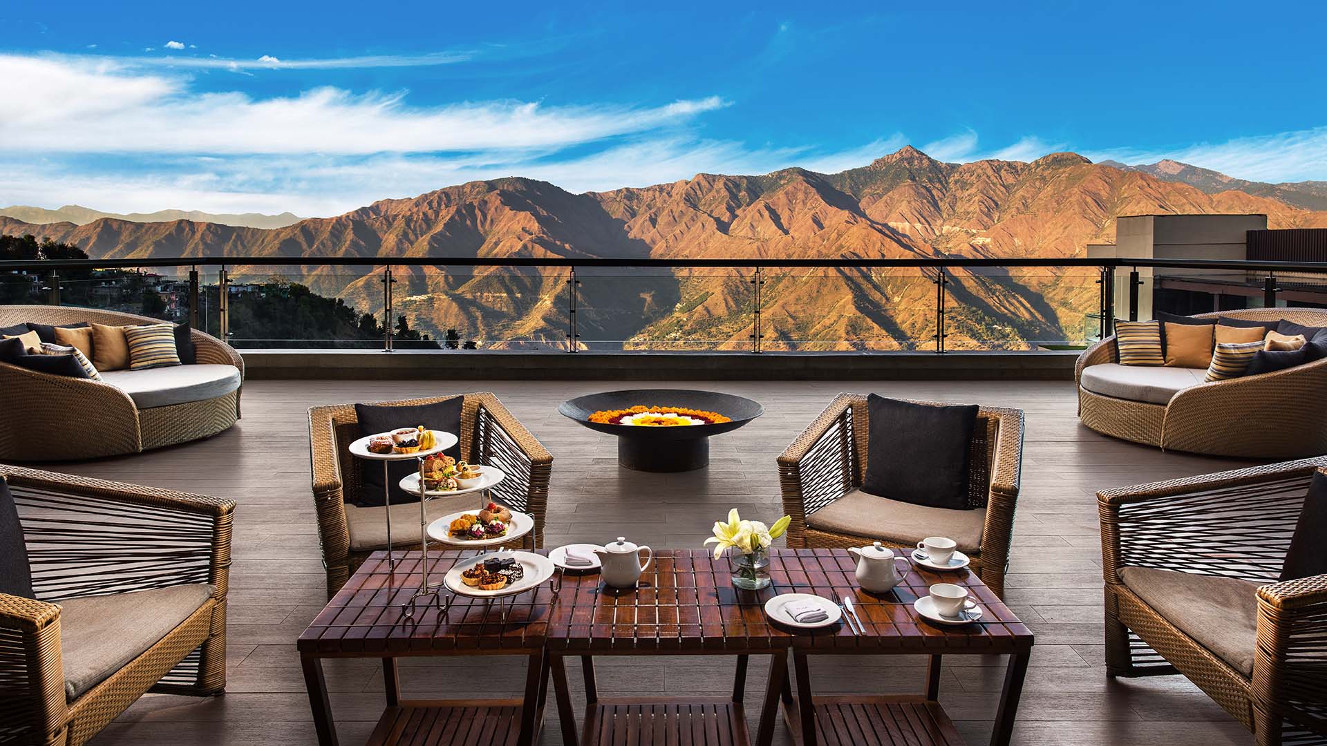 Afternoon tea on a deck overlooking Mussoorie's hills at the JW Marriott Mussoorie Walnut Grove Resort & Spa in India