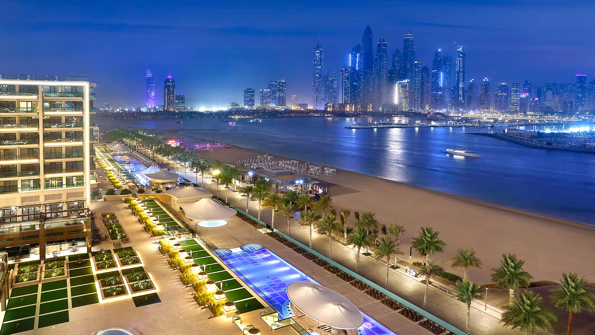 Marriott Resort Palm Jumeirah, Dubai beachfront at night with Dubai skyline