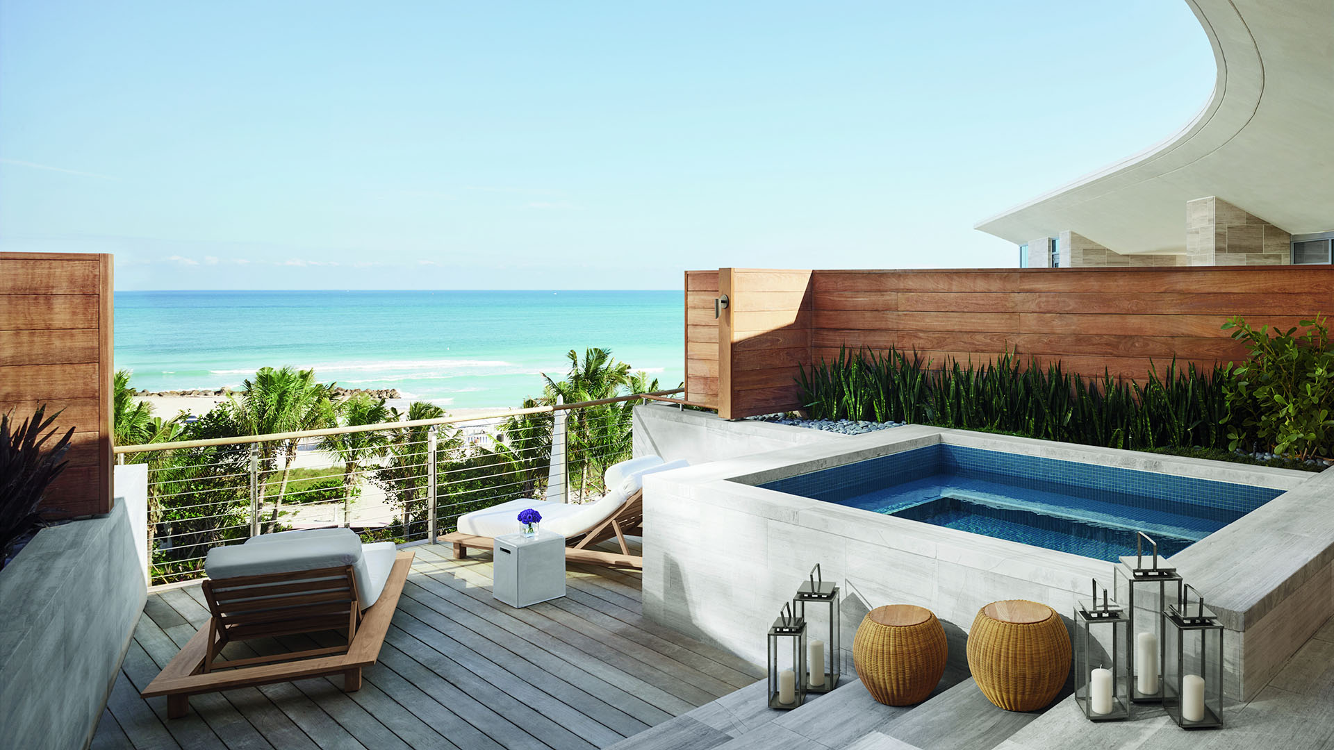 Ocean views from Miami Beach EDITION bungalow porch with a pool