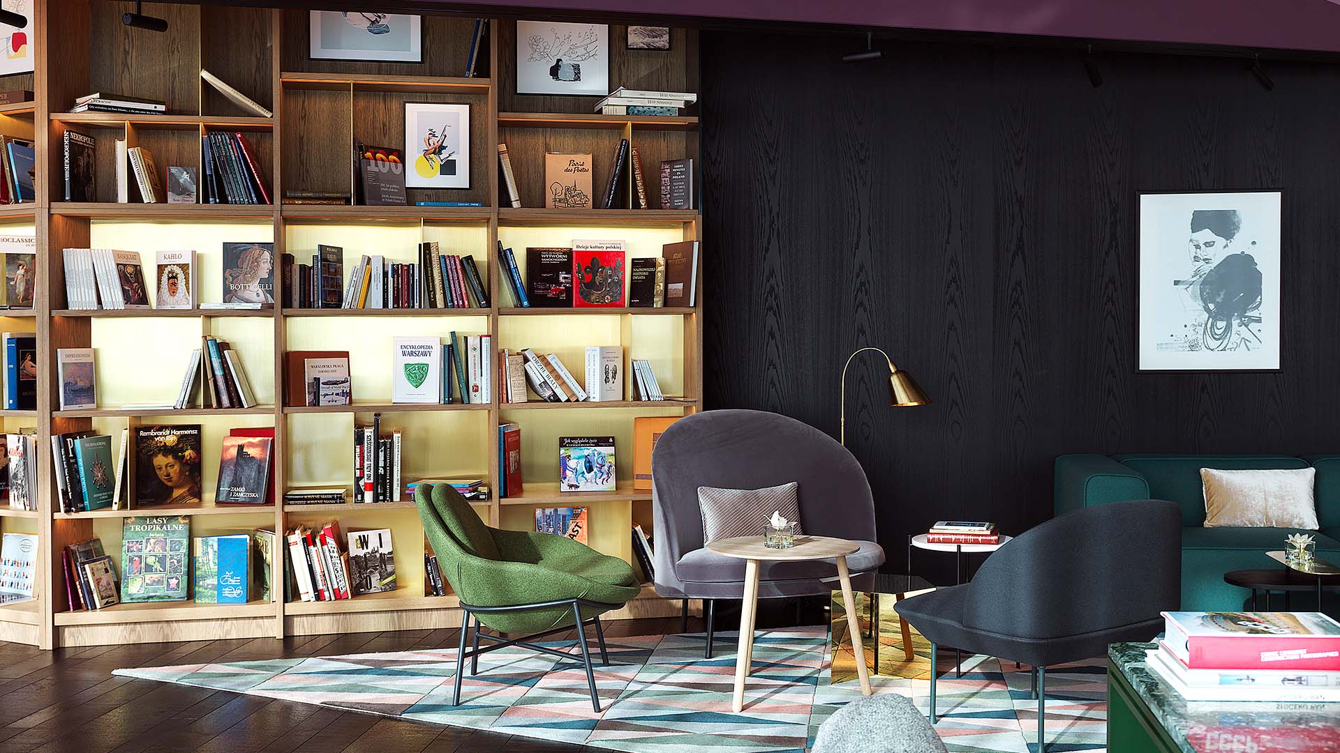 black wooden walls and a wooden bookcase in Warsaw Renaissance Airport Hotel