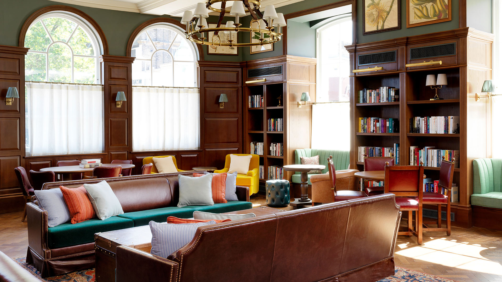 green and wooden library with leather couch at University Arms Hotel, Autograph Collection in Cambridge
