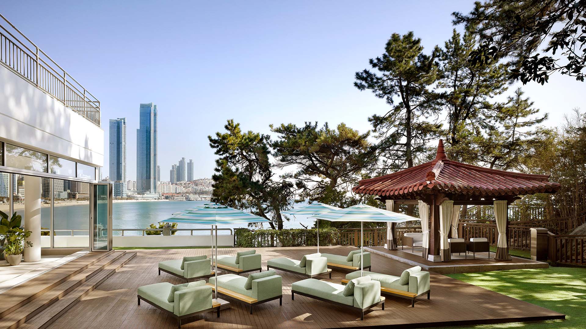 lounge chairs and view of Busan city and Pacific Ocean at The Westin Josun Busan