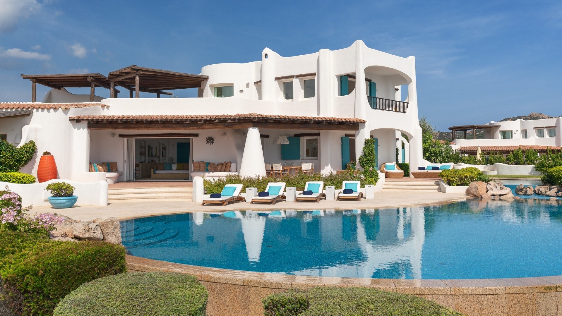 pool and white stone vacation villa at Hotel Romazzino, a Luxury Collection Hotel, Costa Smeralda