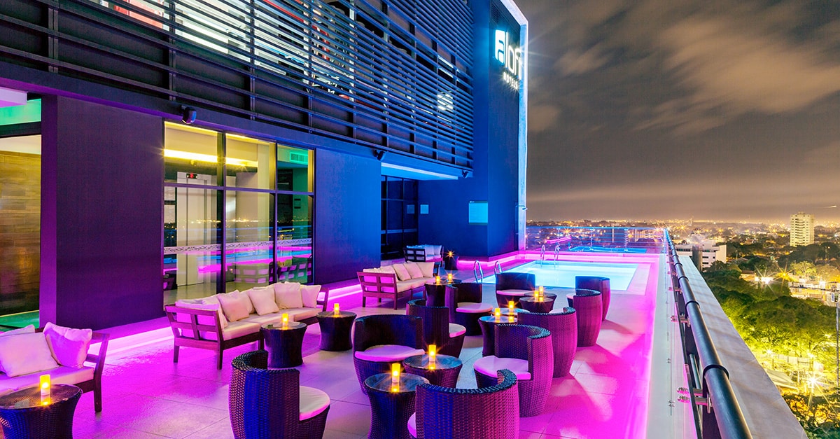 a view of a rooftop deck at Aloft Asuncion in the evening