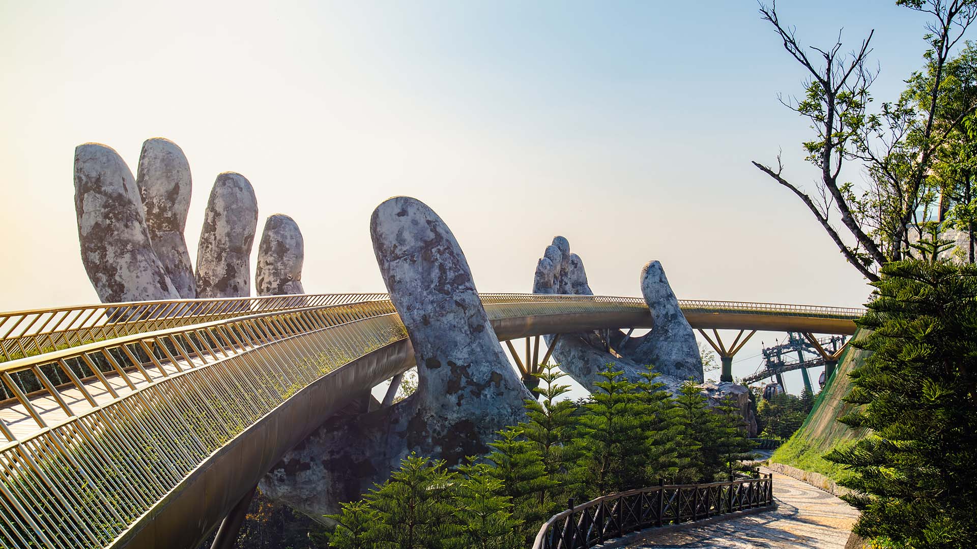 hand monument holding bridge in vietnam