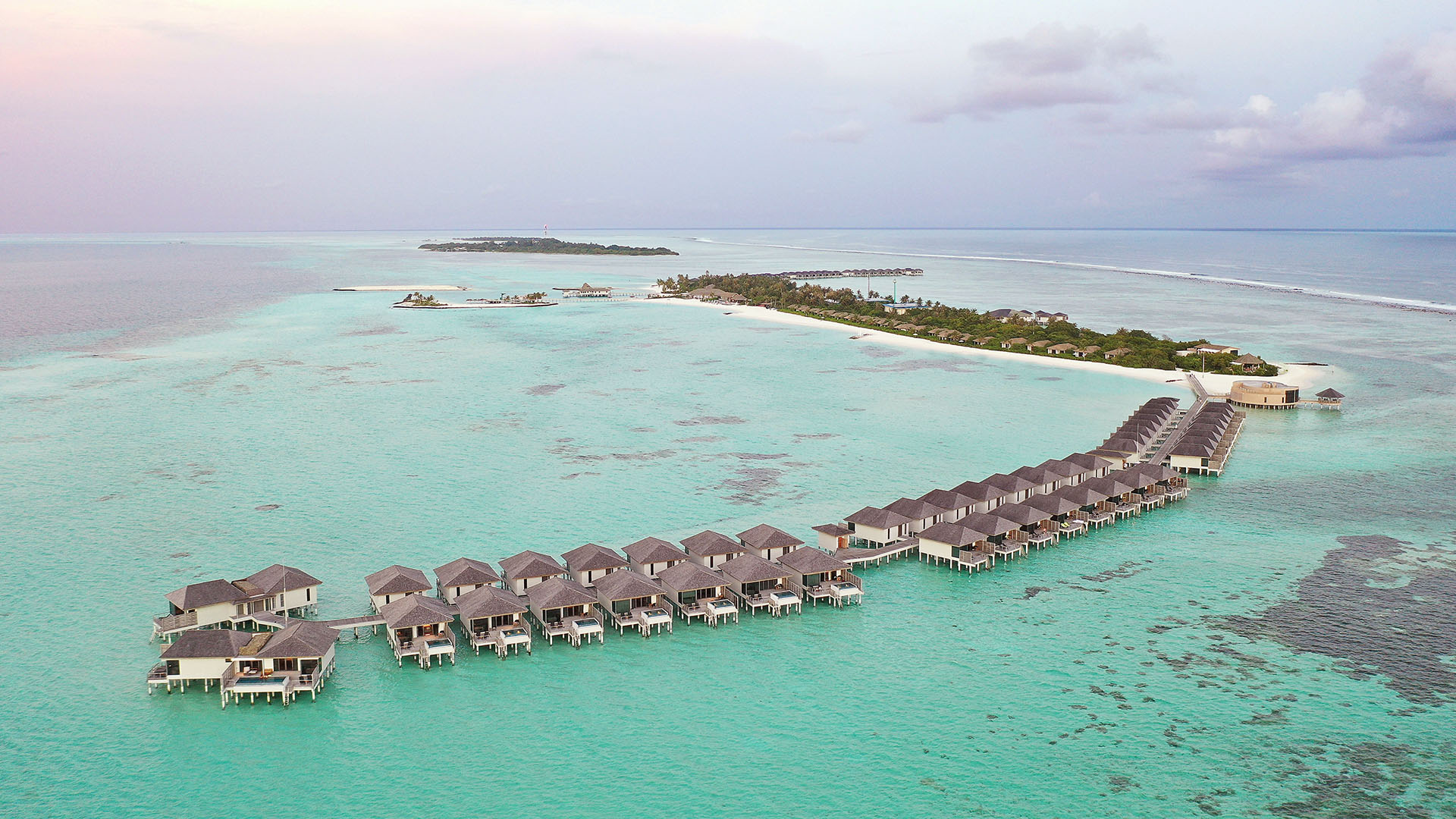 aerial view of overwater villas at Le Méridien Maldives Resort & Spa