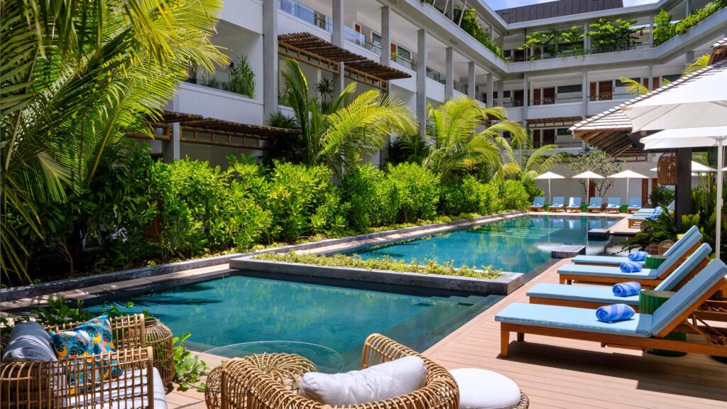 lush foliage, a swimming pool, and a lounge area at Laïla, Seychelles, a Tribute Portfolio Resort 