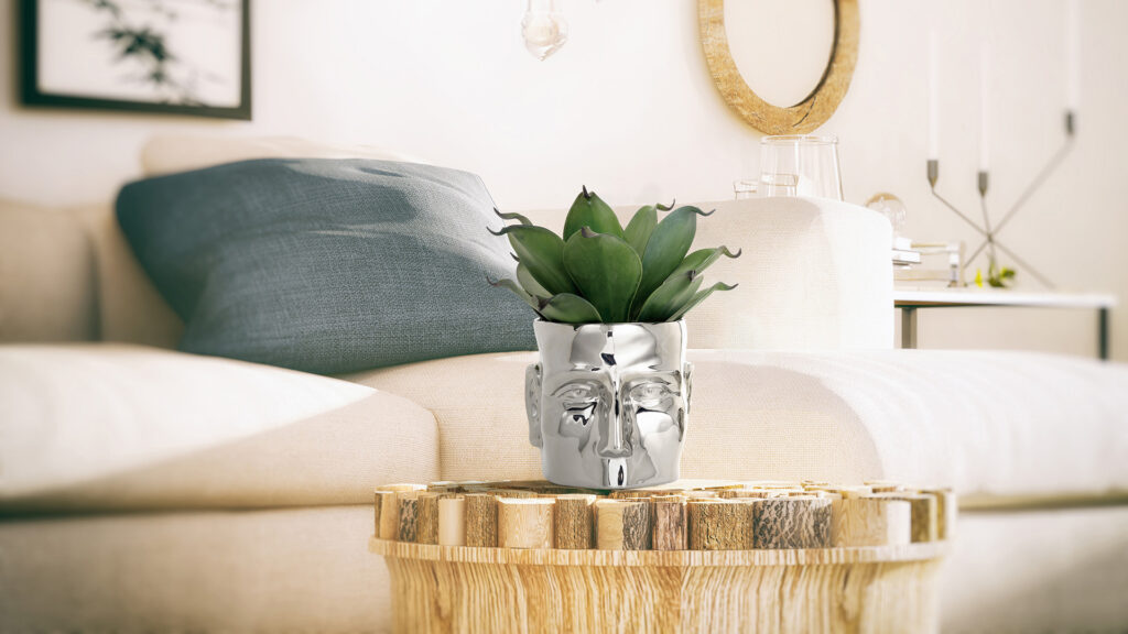 The Face Vase sits on a coffee table, which sits in front of a cream-colored couch