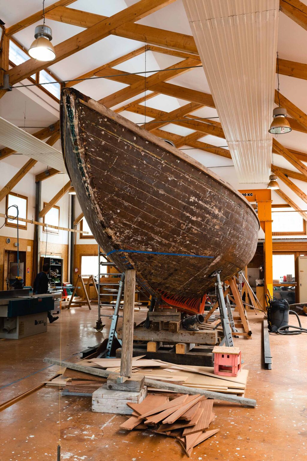A large Catalan boat set up for restoration in Samuel Villevieille's workshop