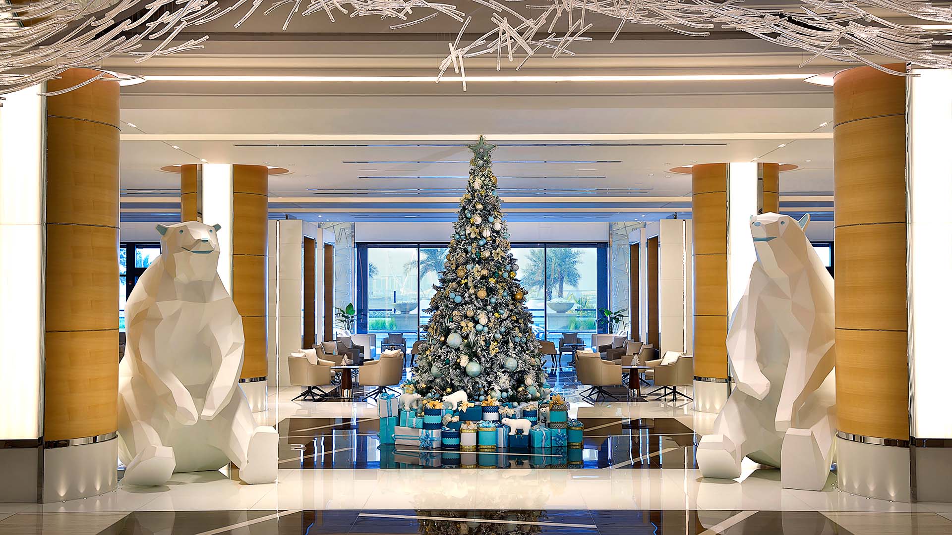 The lobby of Marriott Resort Palm Jumeirah, Dubai with festive decorations, including a Christmas tree and large polar bear statues