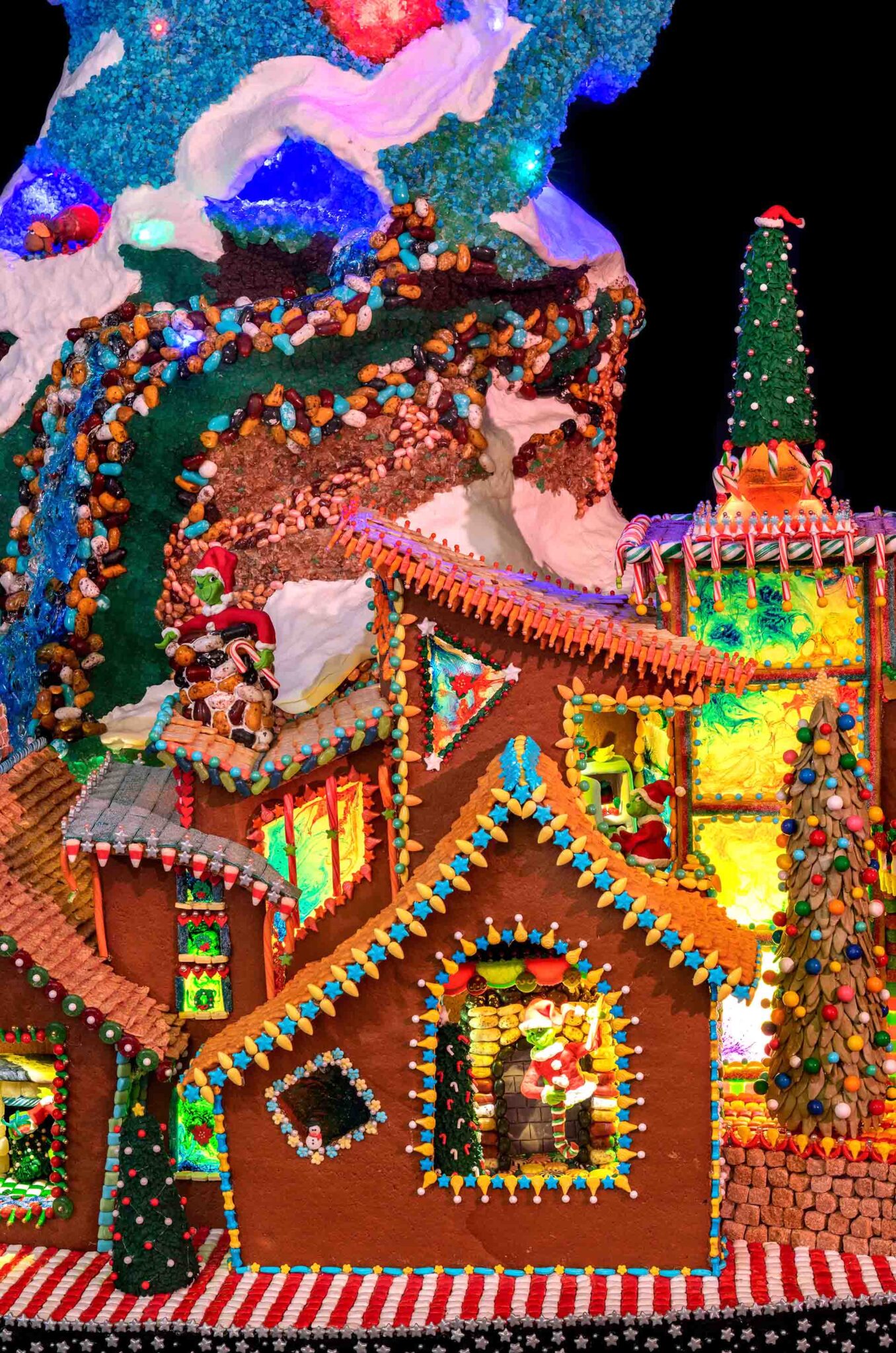 a close up of a colorful gingerbread house