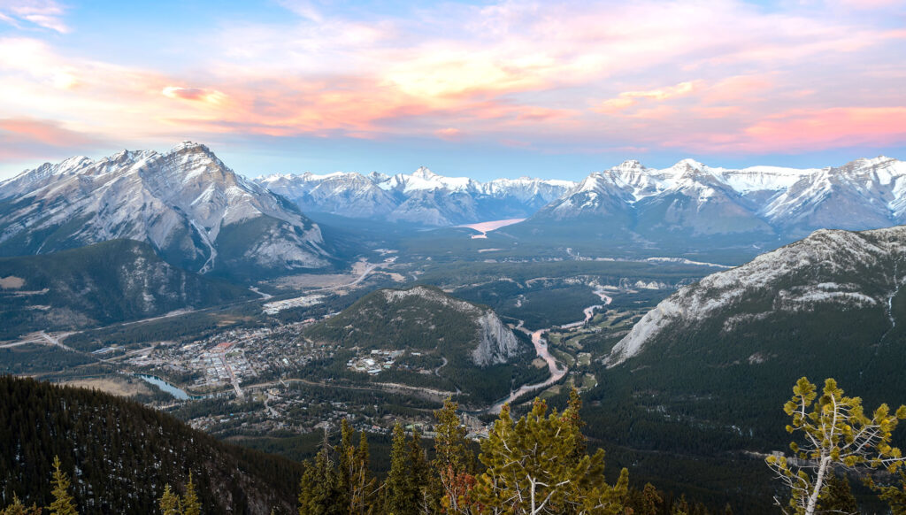 View of snow-capped mountains surrounding Banff in Canada