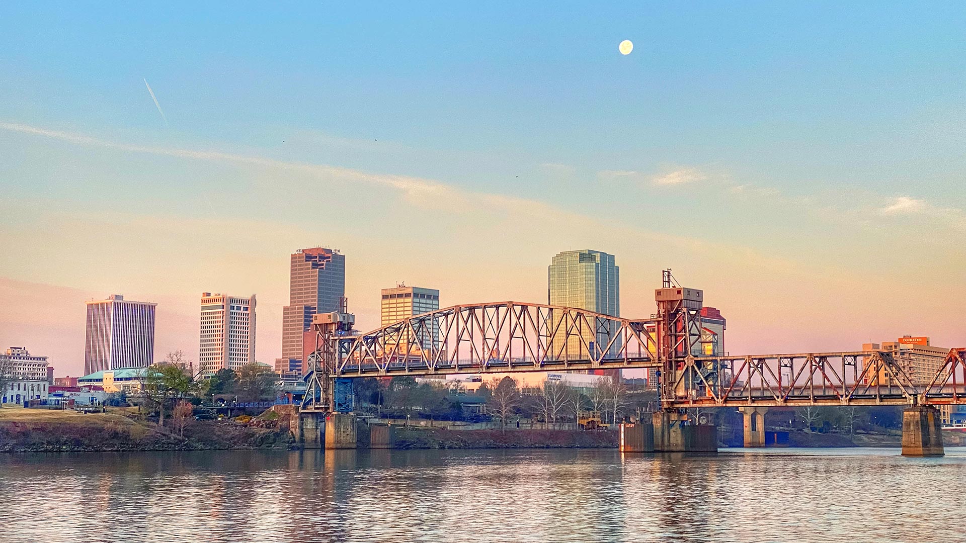 View of the Arkansas River and Little Rock skyline at sunrise