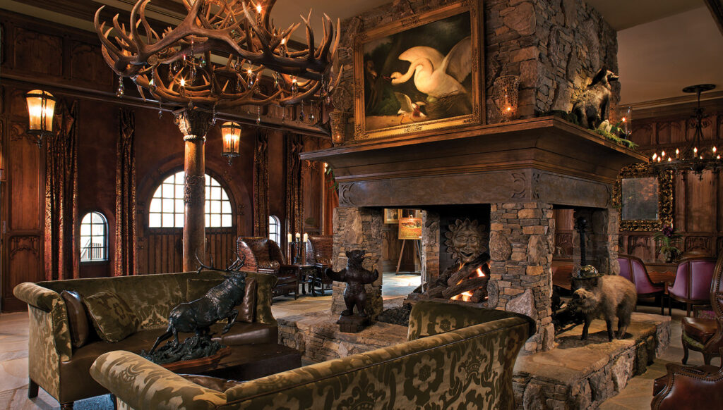 A seating area with cozy couches and a fireplace at Grand Bohemian Hotel Asheville, Autograph Collection
