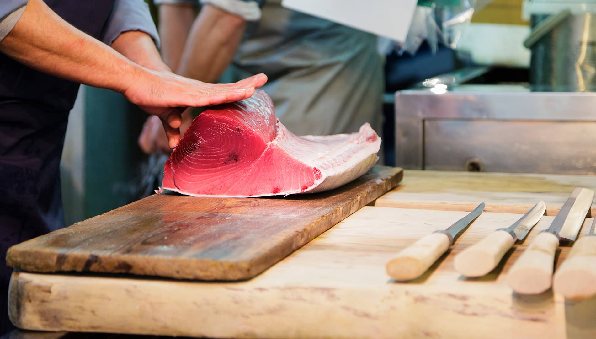 A chef prepares seafood at Tsukiji Outer Market