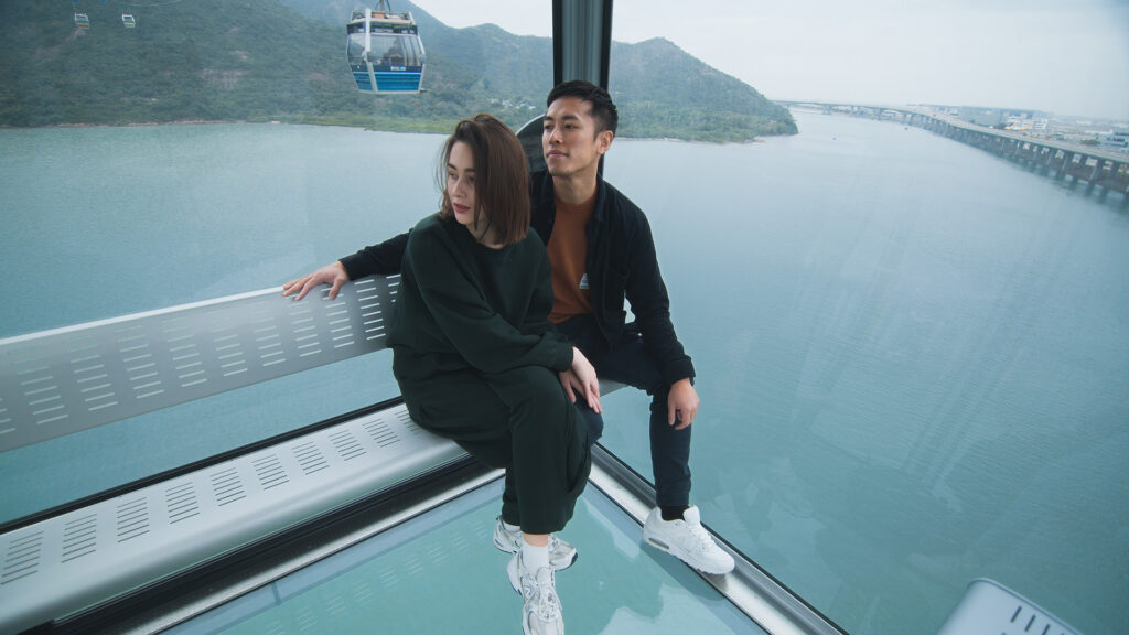 a couple aboard the ngong ping 360 cable car
