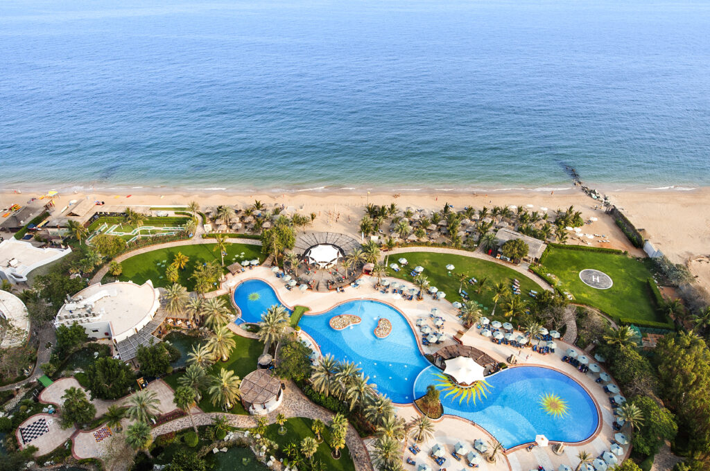aerial view of the pool at le meridien al aqah beach resort.
