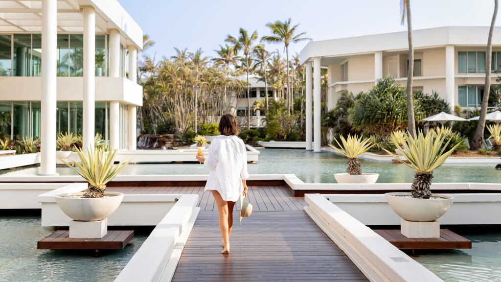woman walking along a walkway at Sheraton Grand Mirage Resort, Gold Coast