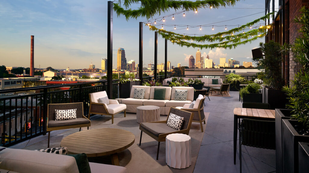 terrace with views of atlanta, bellyard, tribute portfolio hotel