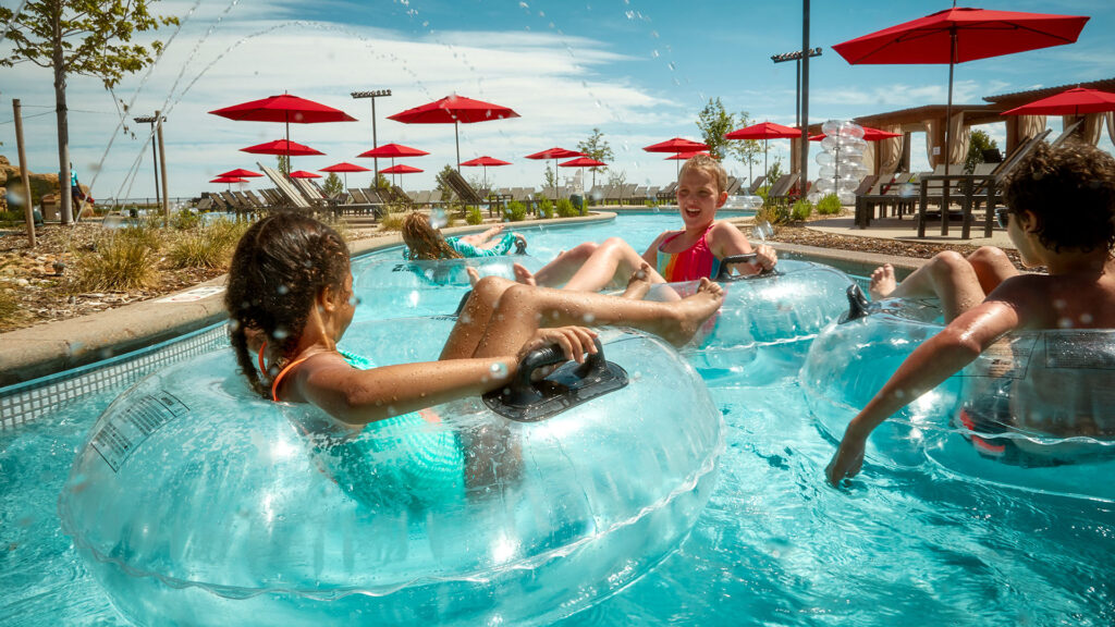 children playing in the lazy pool, gaylord rockies resort