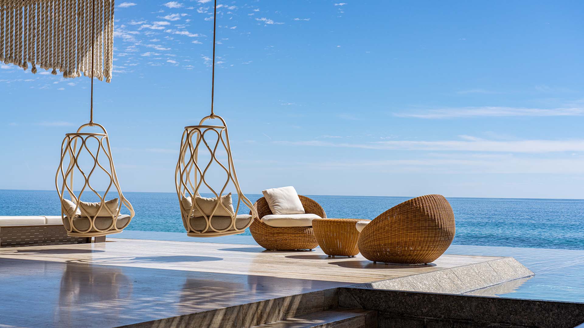 Seating area overlooking the water at Solaz, a Luxury Collection Resort, Los Cabos.