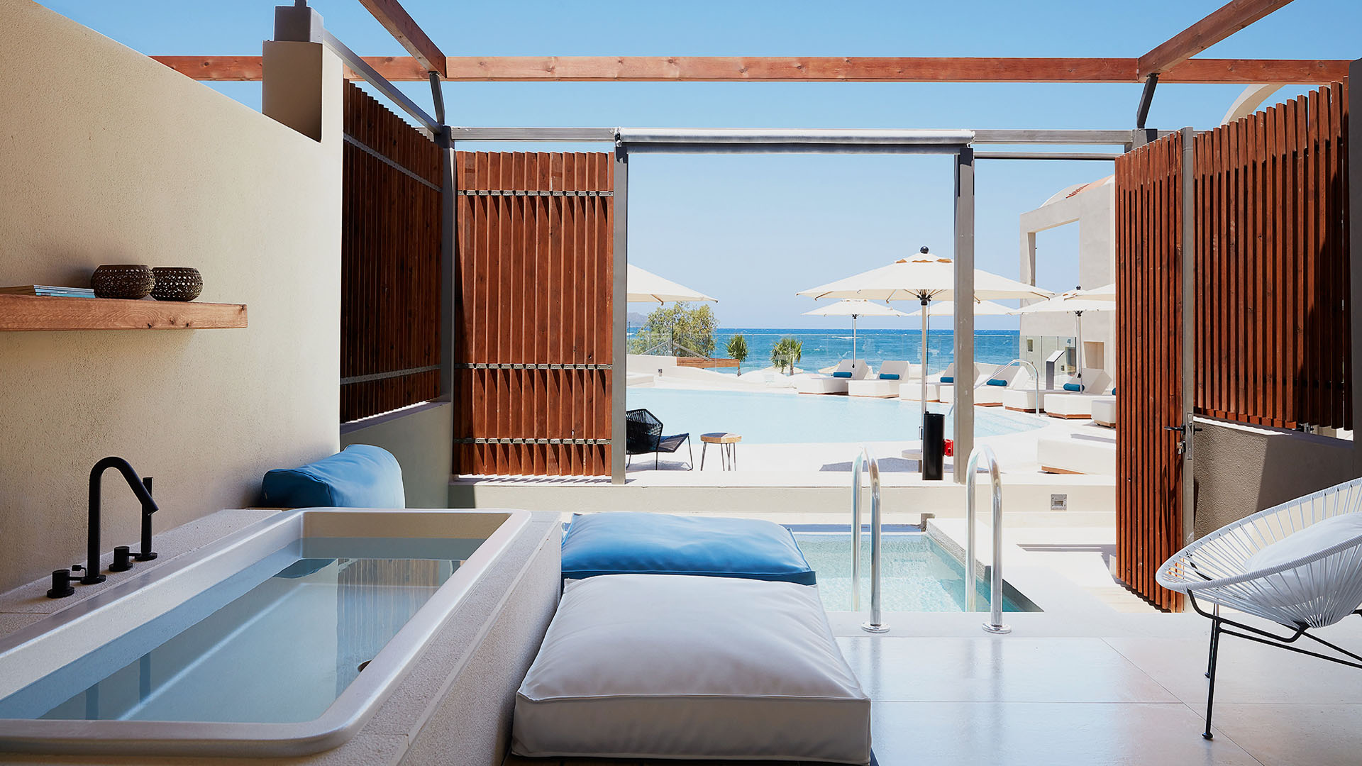 a guest room with a sea view at Domes Noruz Chania, Autograph Collection