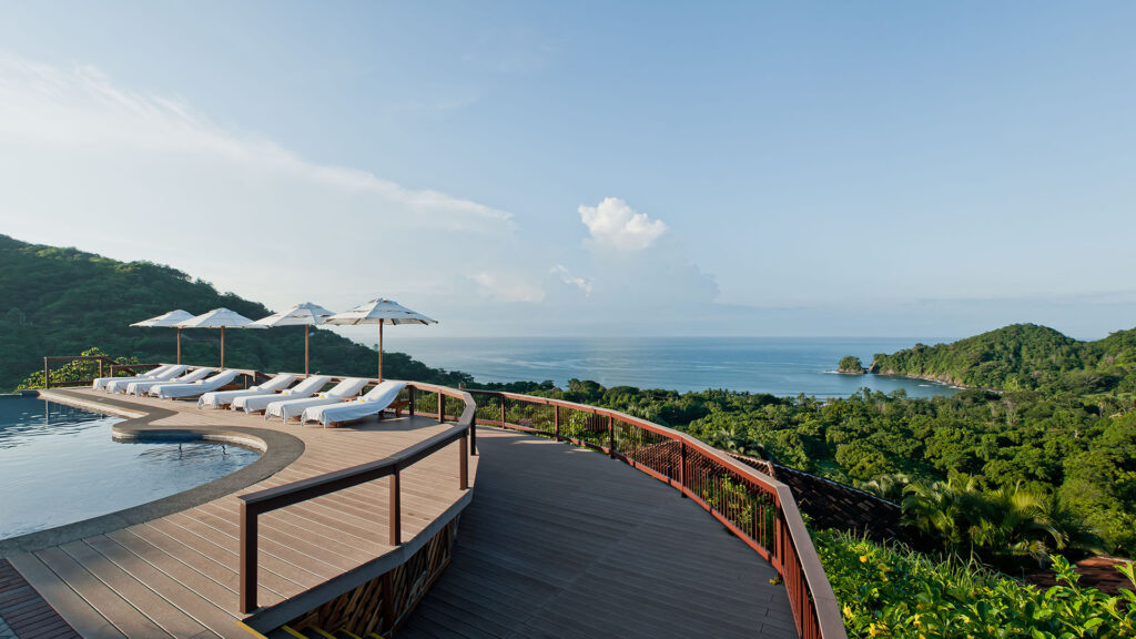 a walkway overlooking the ocean at Punta Islita, Autograph Collection